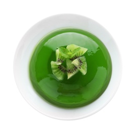 Delicious green jelly with kiwi slices on white background, top view