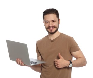 Photo of Happy man with laptop showing thumbs up on white background