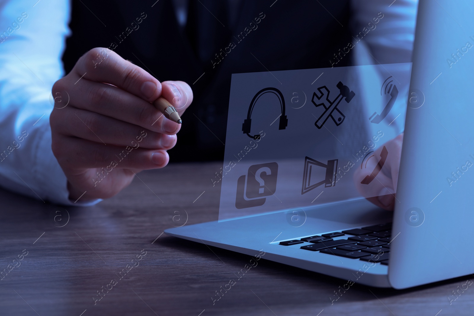 Image of Webinar. Man using laptop and virtual screen at table, closeup