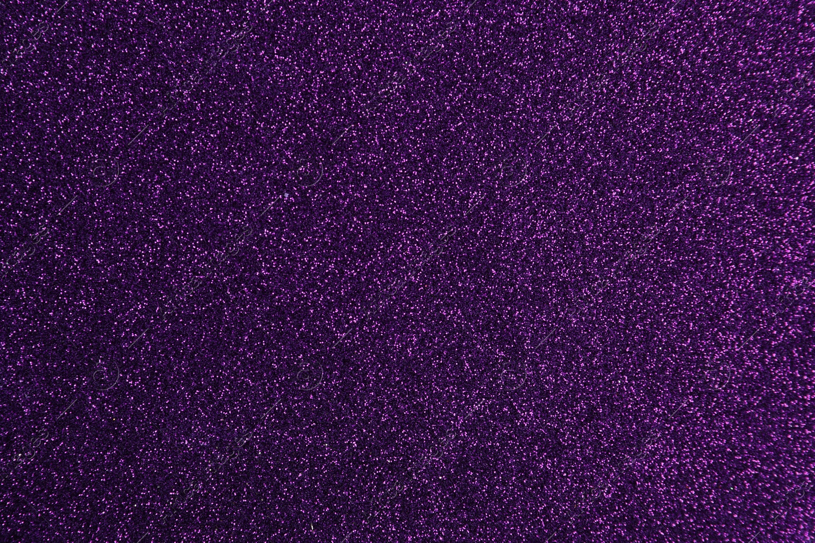Photo of Shiny dark purple glitter as background, closeup