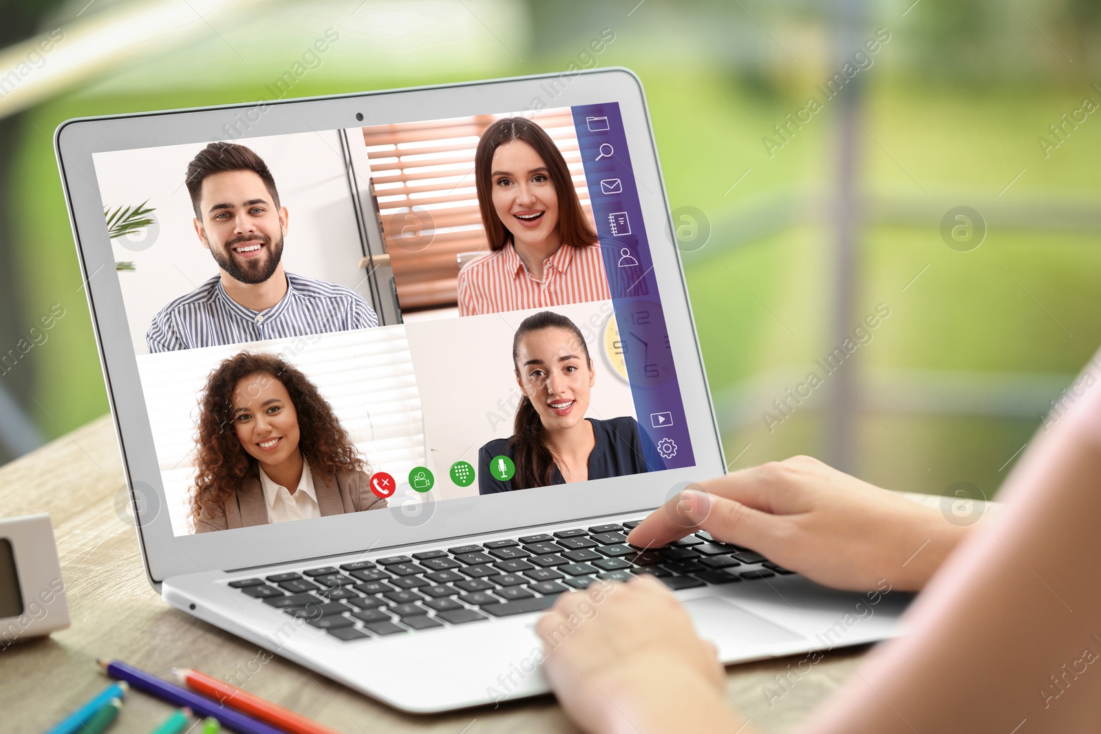 Image of Woman having video chat with team at table, closeup