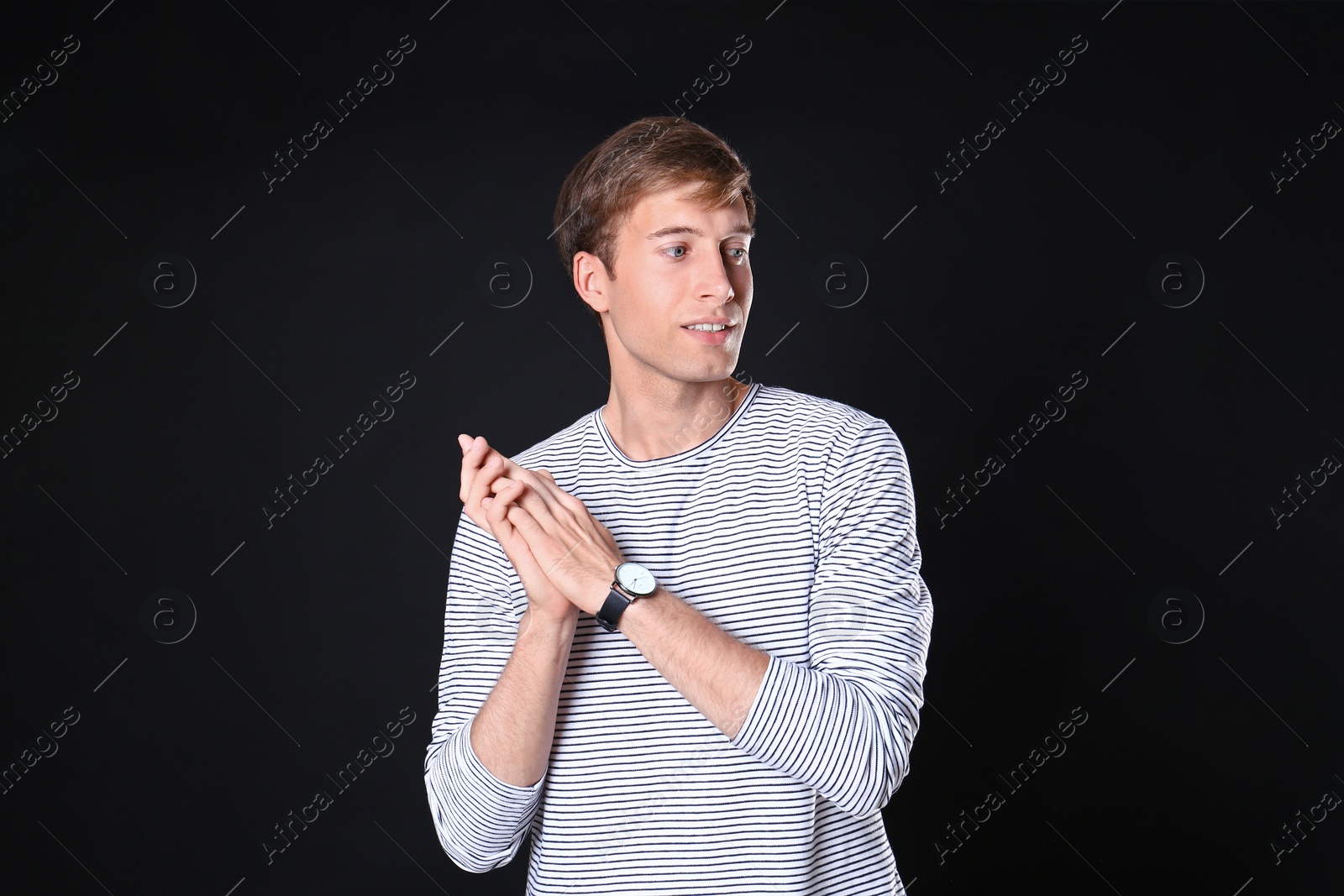 Photo of Portrait of handsome man on black background