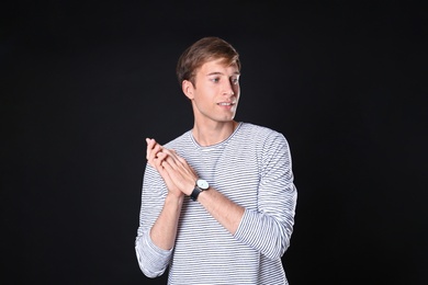 Photo of Portrait of handsome man on black background