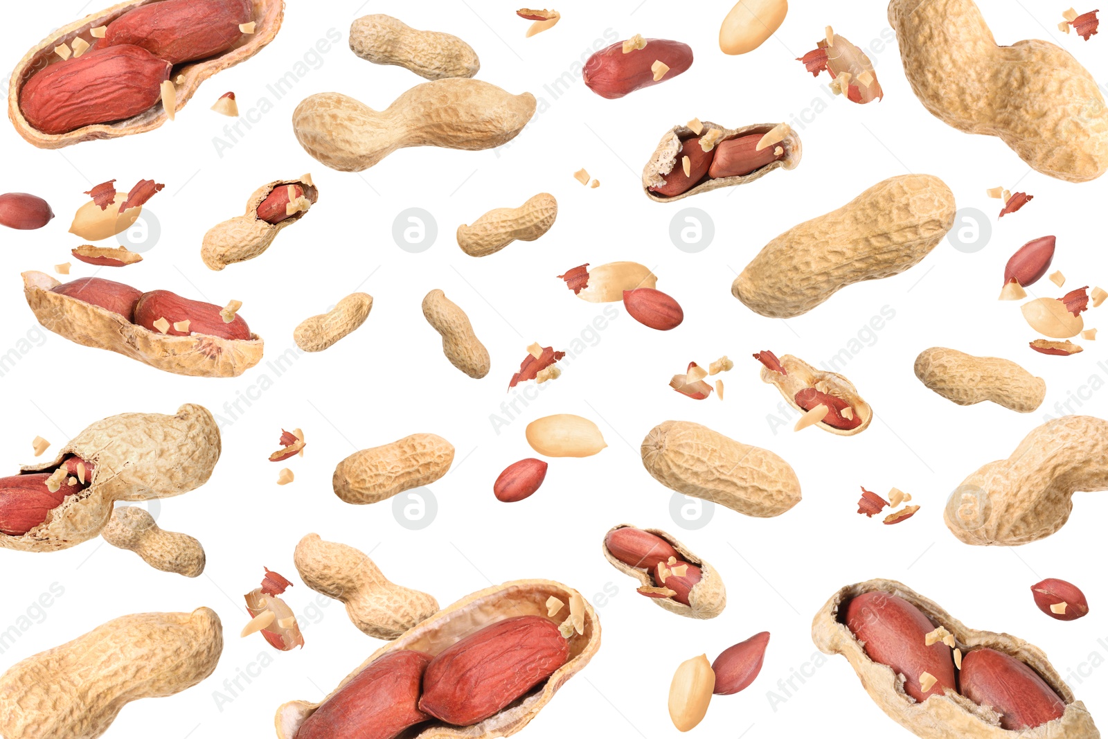 Image of Unpeeled peanuts in air on white background