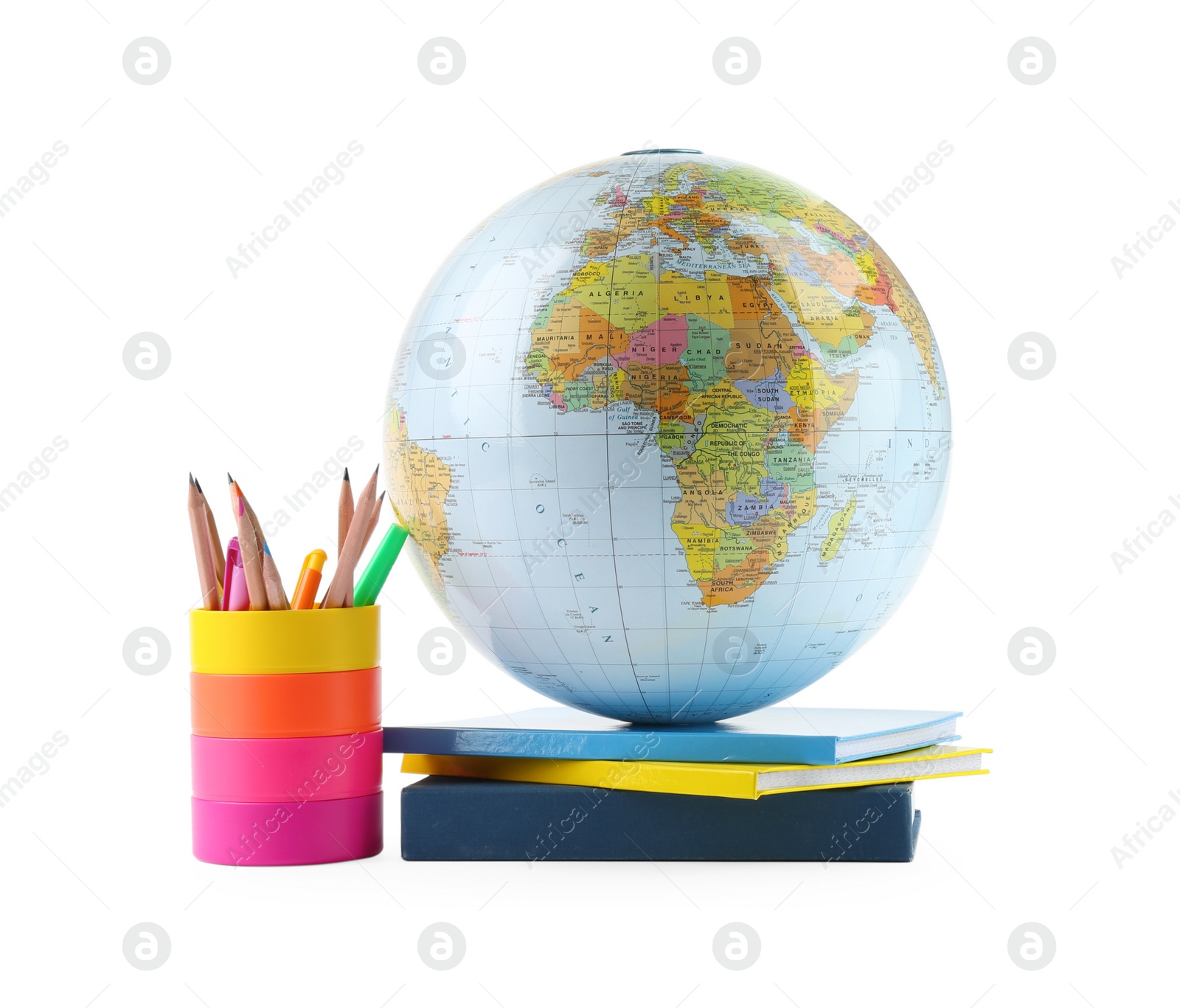 Photo of Plastic model globe of Earth, colorful pencils and books on white background. Geography lesson