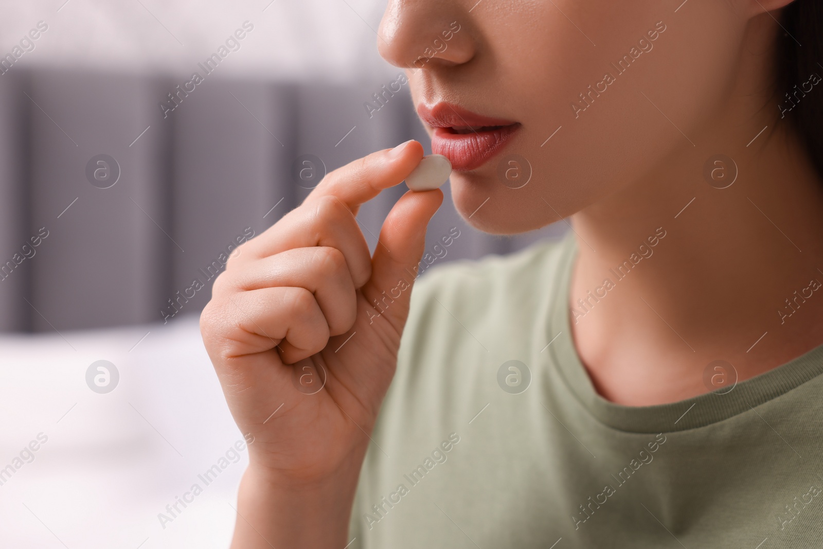 Photo of Woman taking antidepressant pill indoors, closeup. Space for text