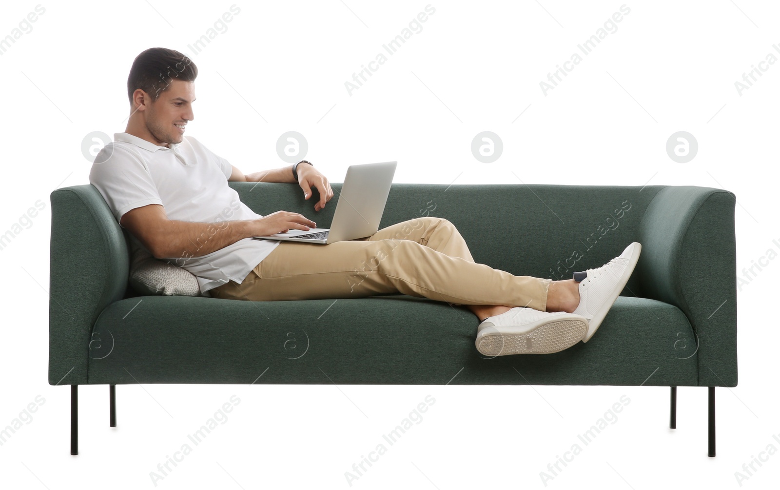 Photo of Man with laptop on comfortable green sofa against white background