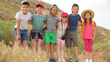 Cute little children outdoors on summer day. Camping trip