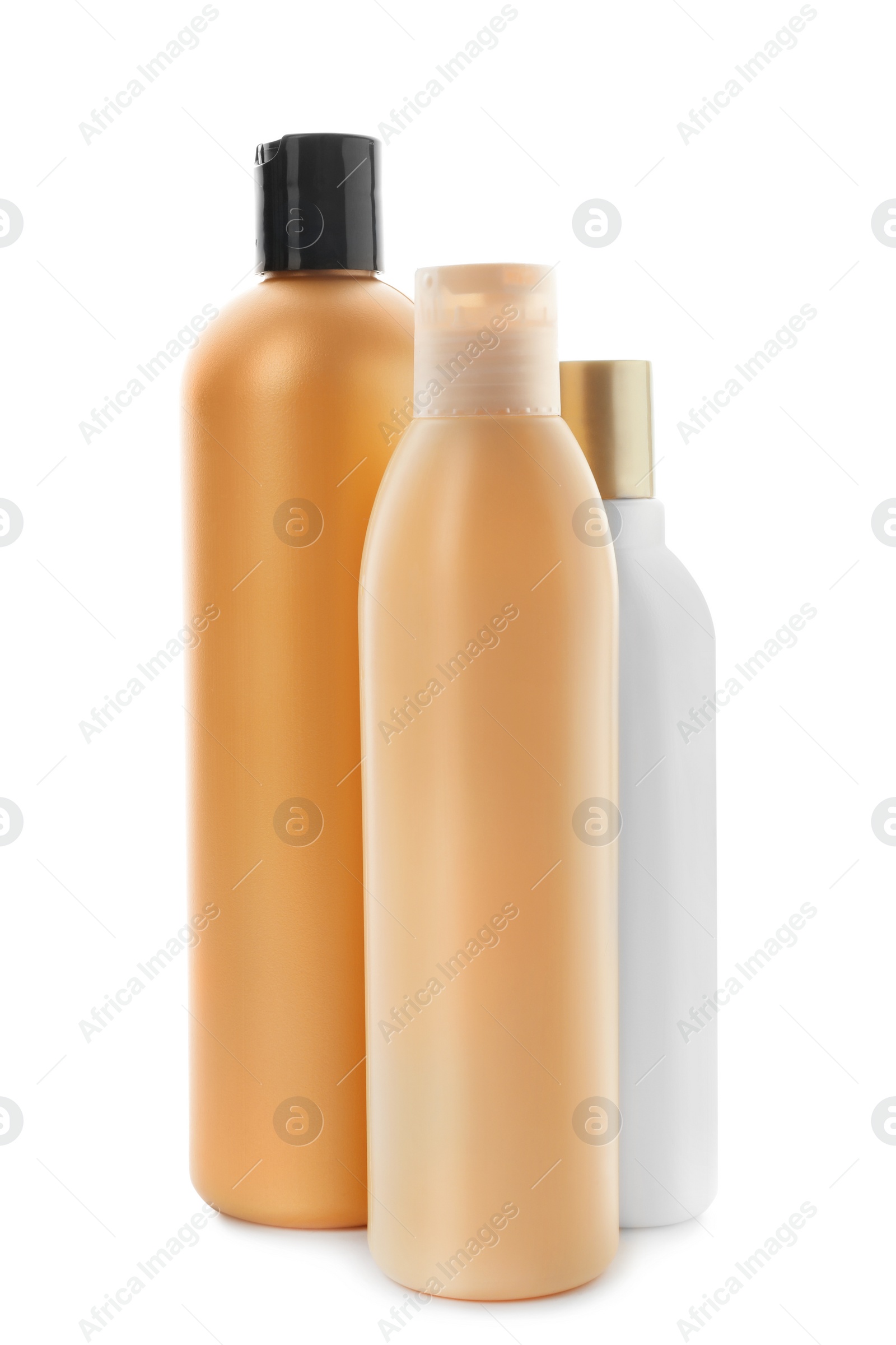 Photo of Bottles with cosmetic products on white background. Mockup for design