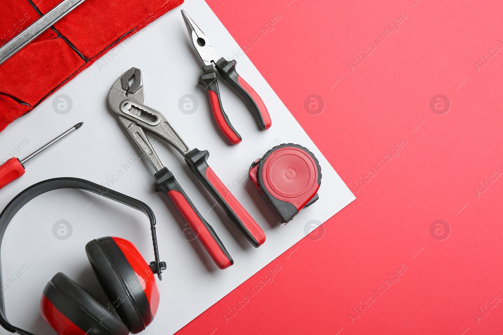 Photo of Flat lay composition with construction tools on color background, space for text