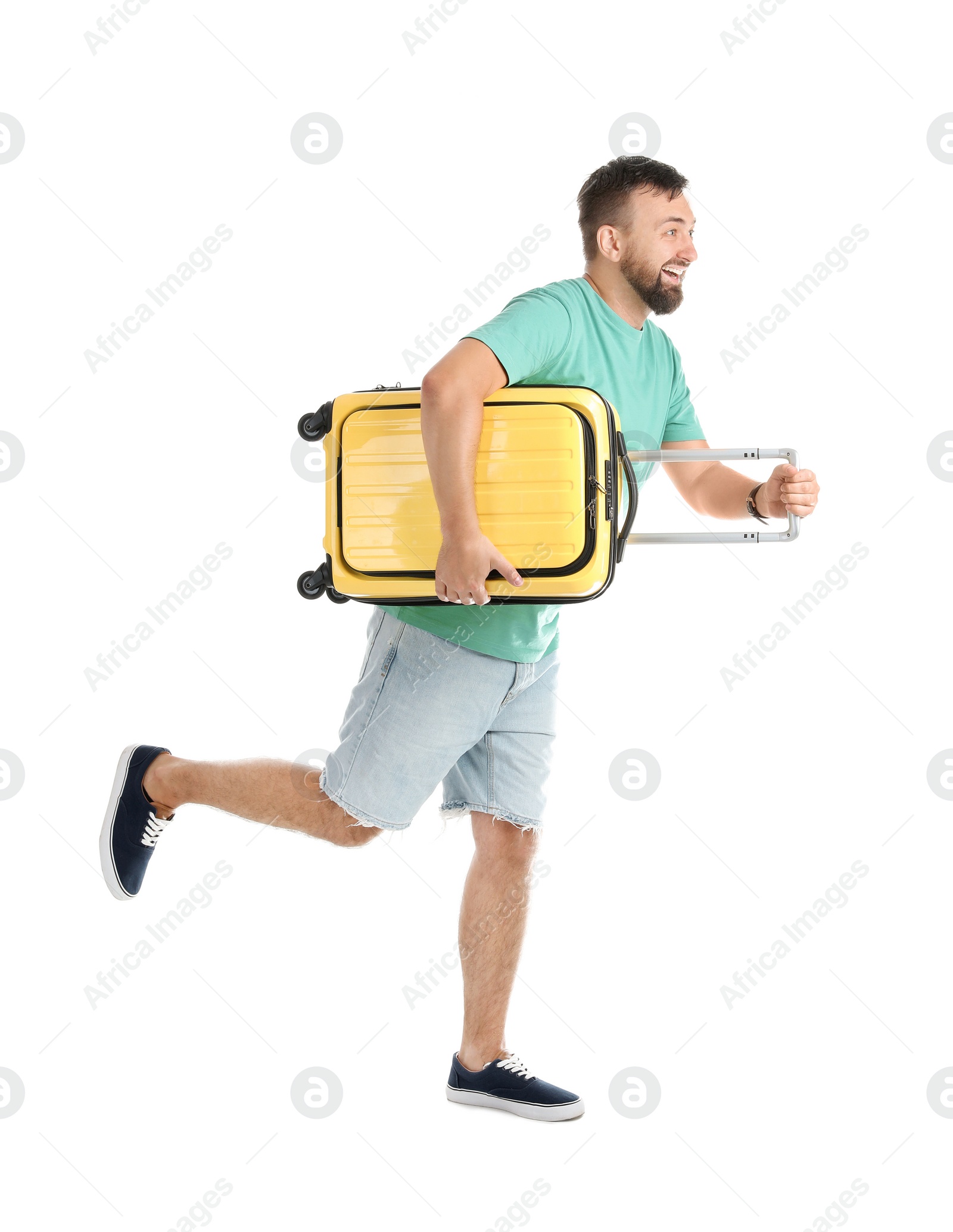 Photo of Man with suitcase running on white background. Vacation travel