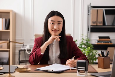 Photo of Portrait of notary at table in office