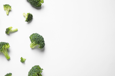 Photo of Fresh tasty broccoli on white background, top view