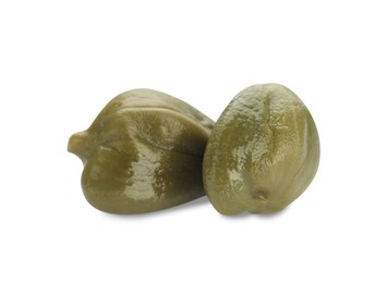 Two delicious pickled capers on white background
