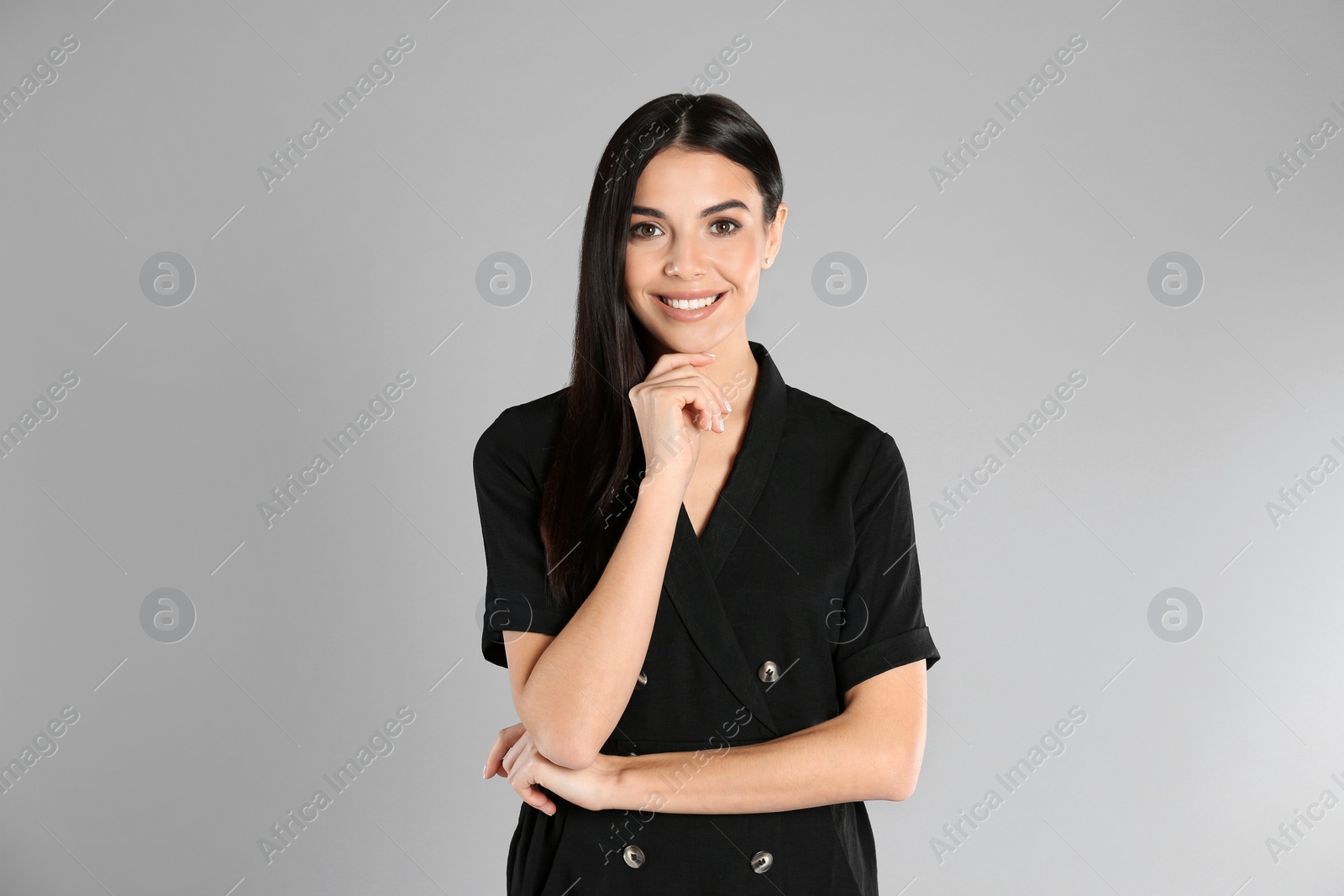 Photo of Portrait of young woman on light grey background