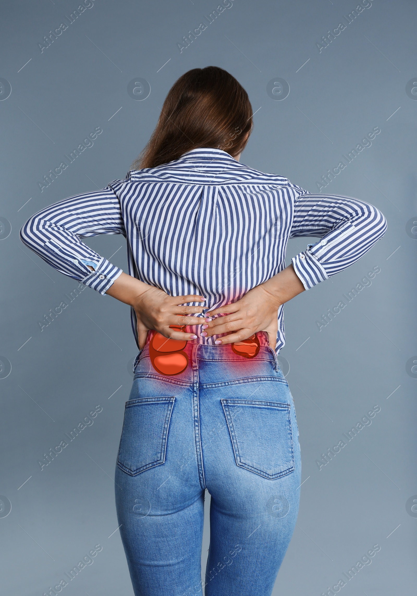 Image of Woman suffering from kidney pain on grey background