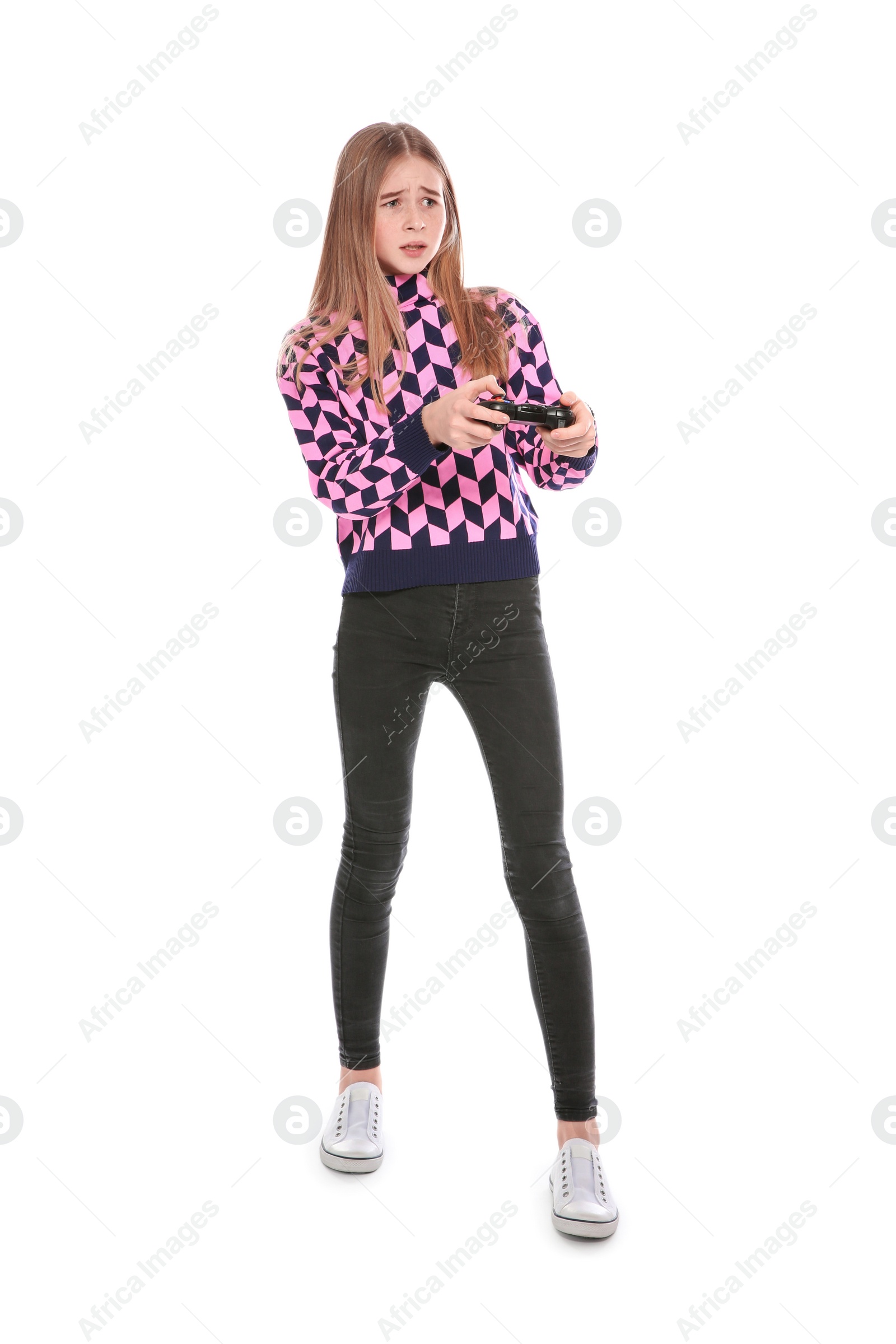 Photo of Teenage girl playing video games with controller isolated on white
