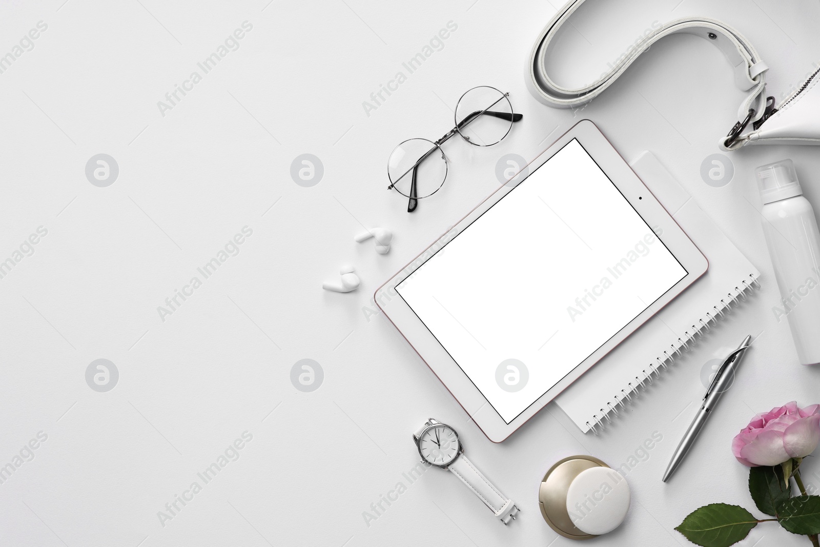 Photo of Flat lay composition with modern tablet on white background. Space for text