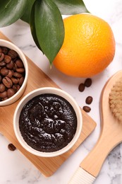 Photo of Flat lay composition with natural body scrub and fresh ingredients on white marble table. Anti cellulite treatment