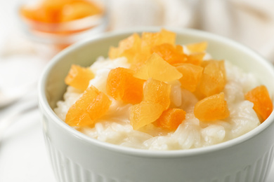 Delicious rice pudding with dried apricots, closeup