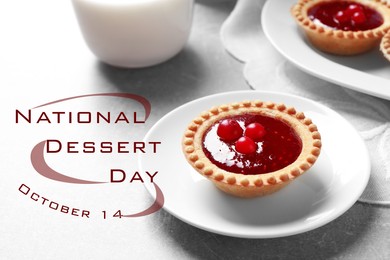 National Dessert Day, October 14. Tasty tartlet with jam on light grey table