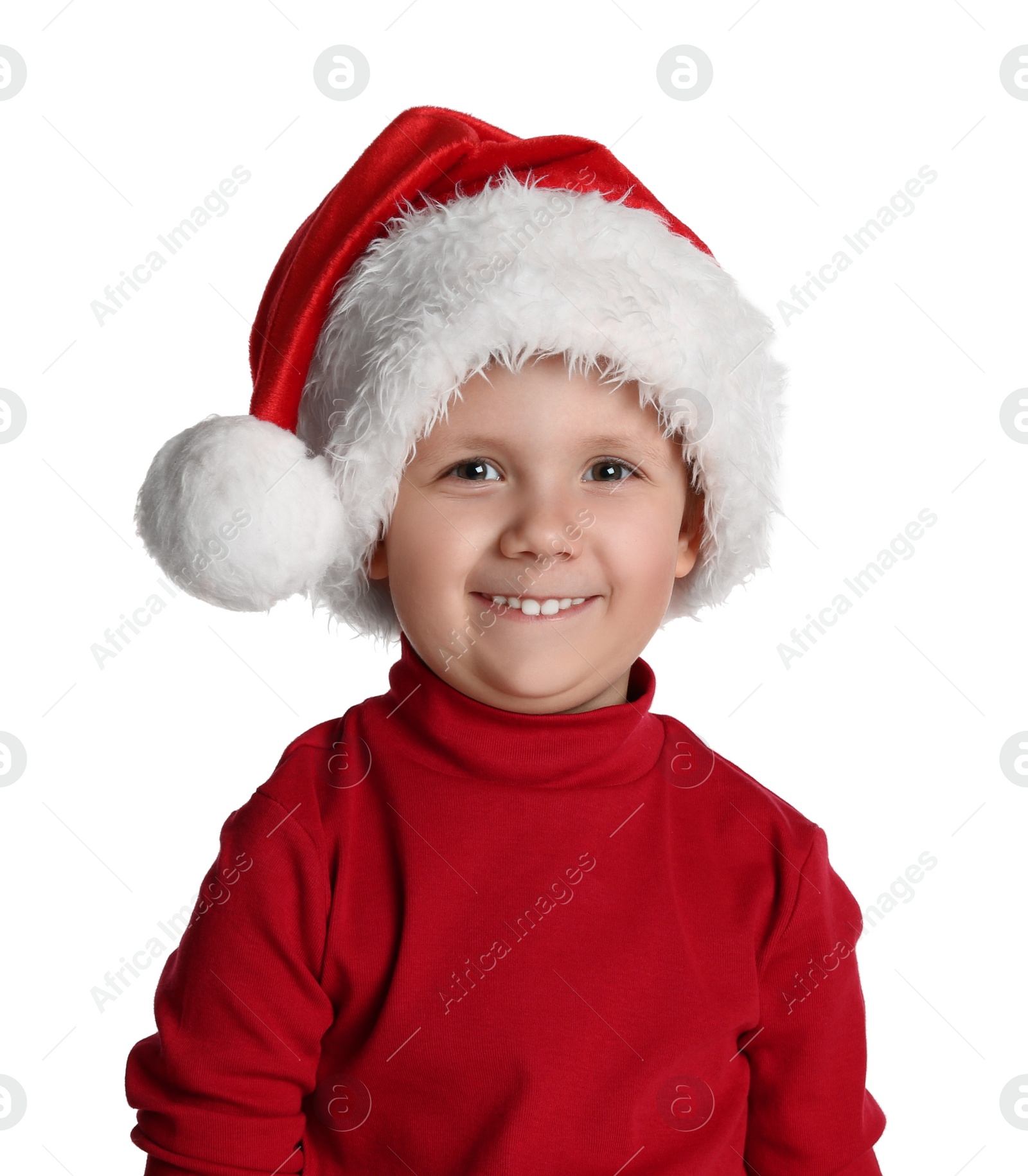 Photo of Cute child in Santa hat on white background. Christmas celebration