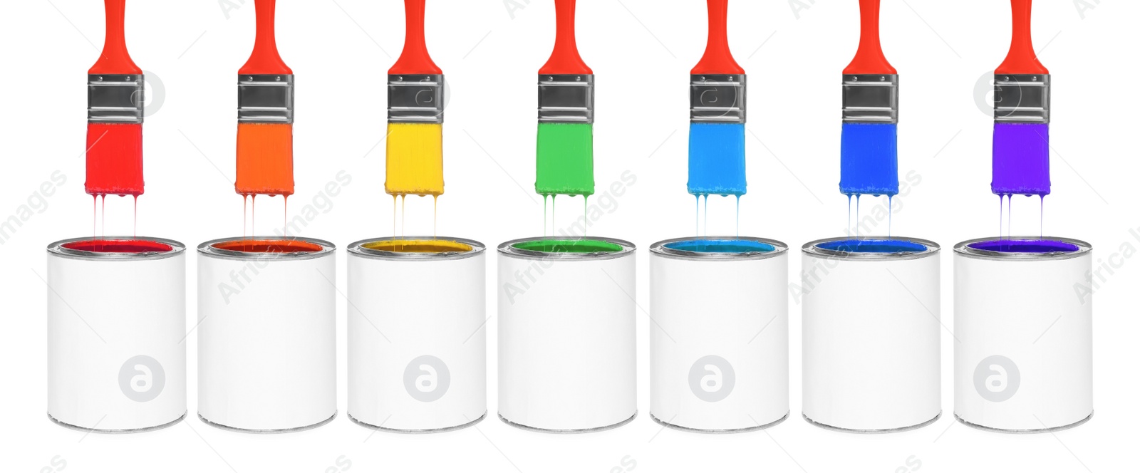 Image of Brushes with colorful paints in air over cans on white background