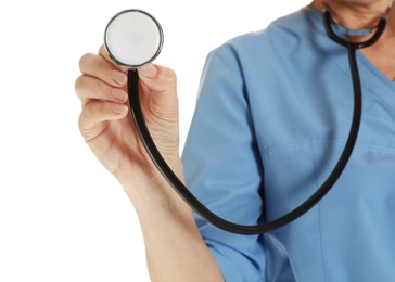 Closeup of female doctor in scrubs with stethoscope isolated on white. Medical staff