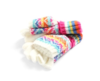 Photo of Warm knitted kid's mittens on white background