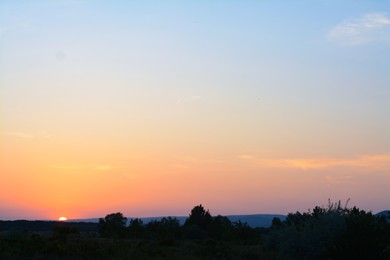 Picturesque view of countryside landscape at sunset