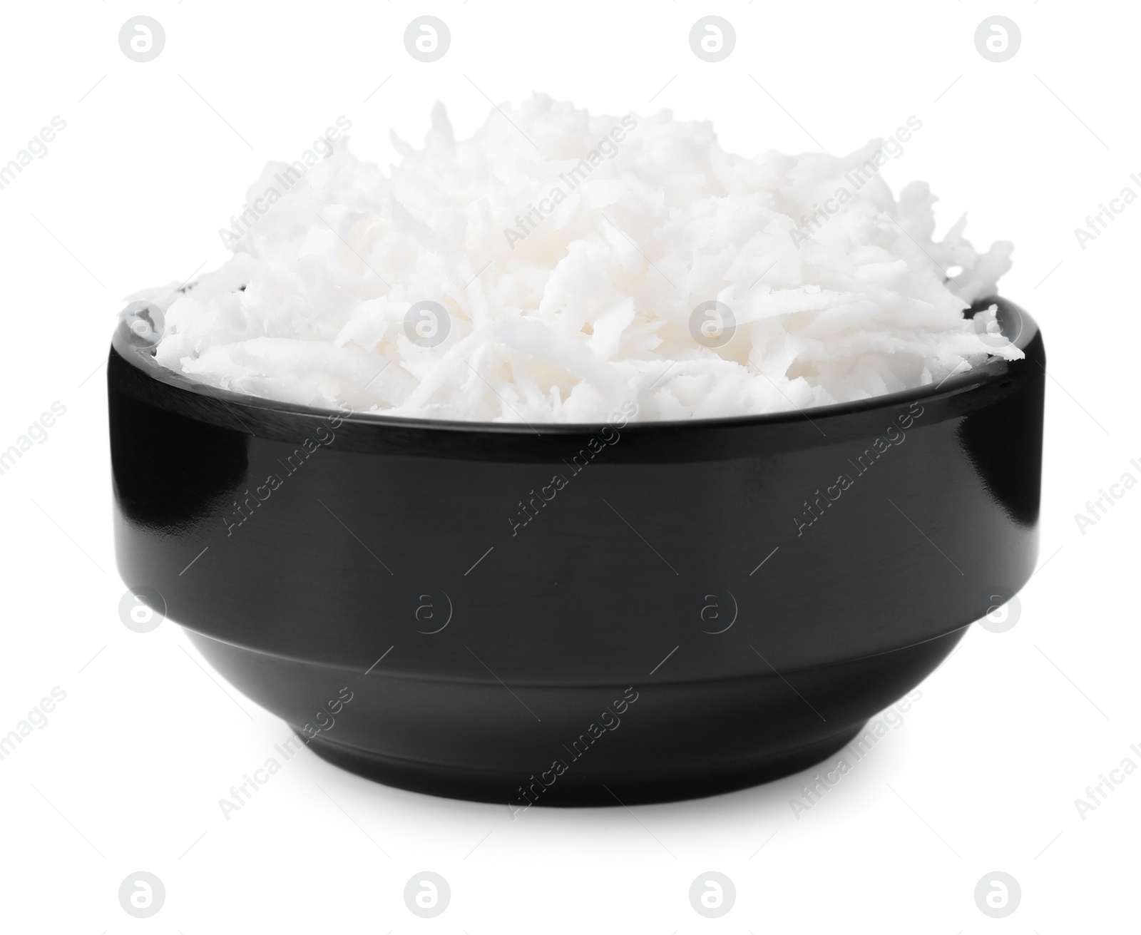 Photo of Coconut flakes in bowl isolated on white