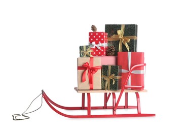 Photo of Sleigh with Christmas gifts on white background