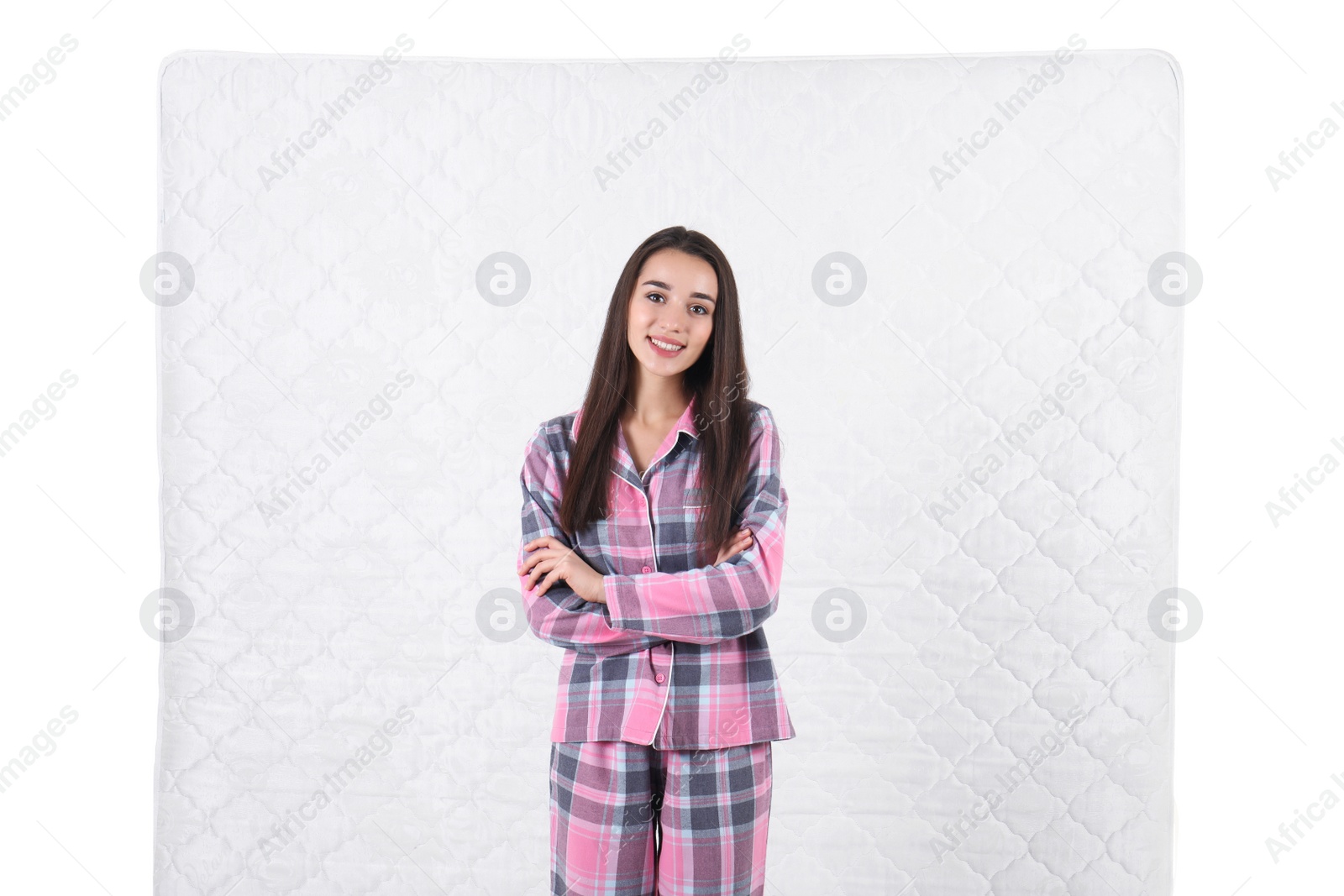 Photo of Young woman with comfortable mattress isolated on white