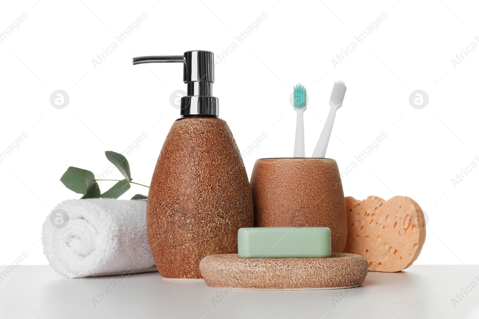 Photo of Bath accessories. Different personal care products and eucalyptus branch on table against white background