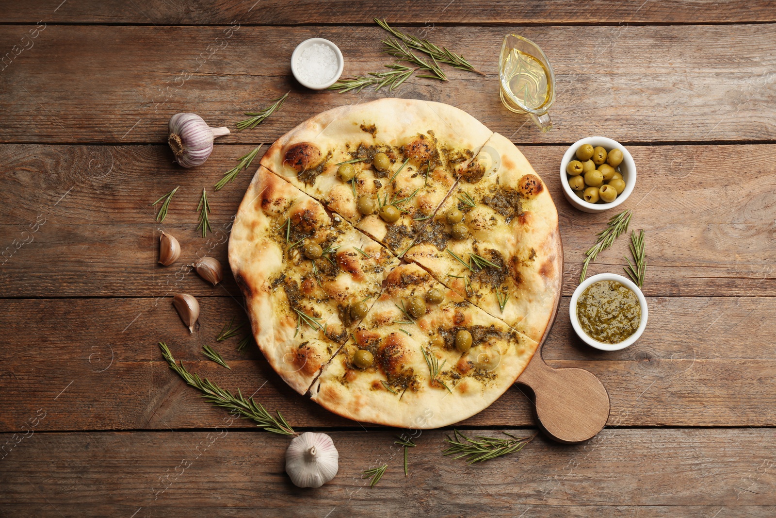 Photo of Flat lay composition with focaccia bread on wooden table