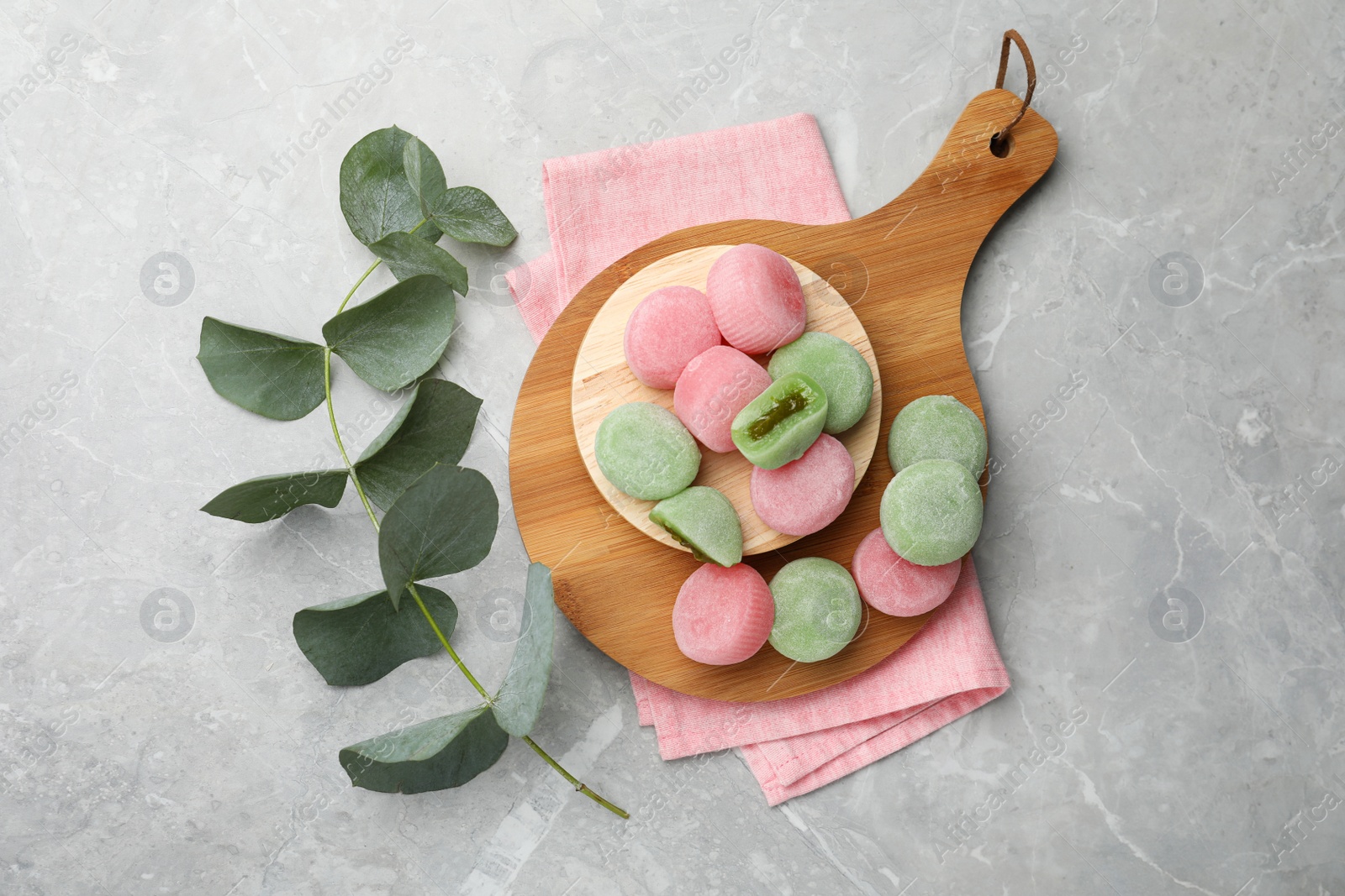 Photo of Flat lay composition with delicious mochi on grey table. Traditional Japanese dessert