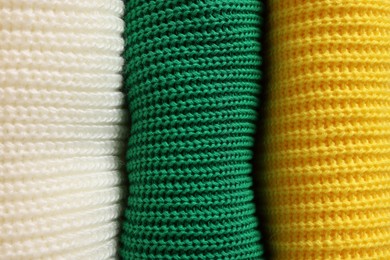 Closeup view of different warm folded sweaters as background