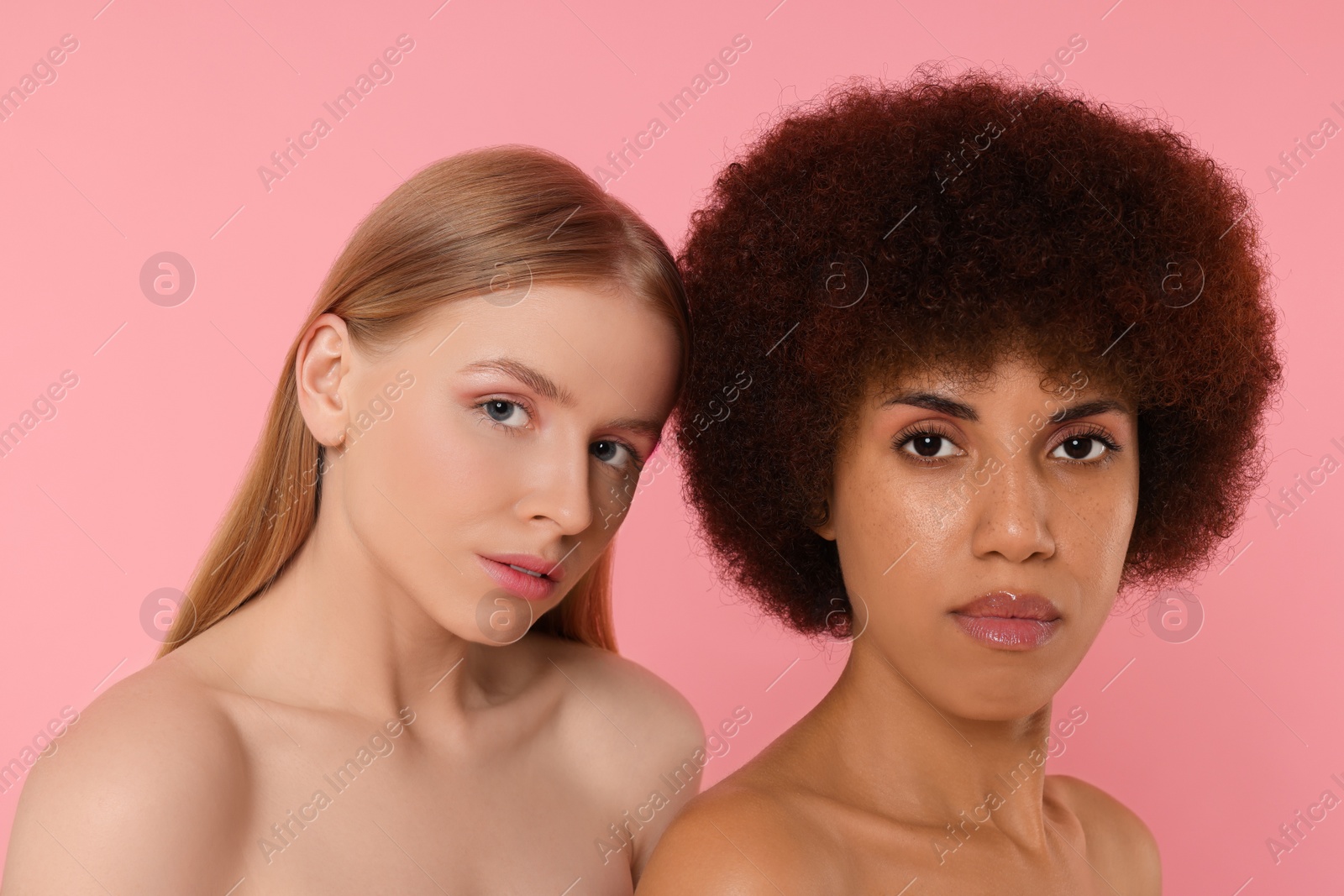 Photo of Portrait of beautiful young women on pink background