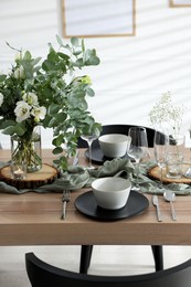 Festive table setting with beautiful tableware and decor indoors