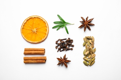 Photo of Different mulled wine ingredients on white background, flat lay