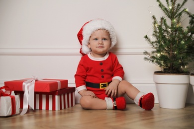 Baby in cute Christmas outfit at home