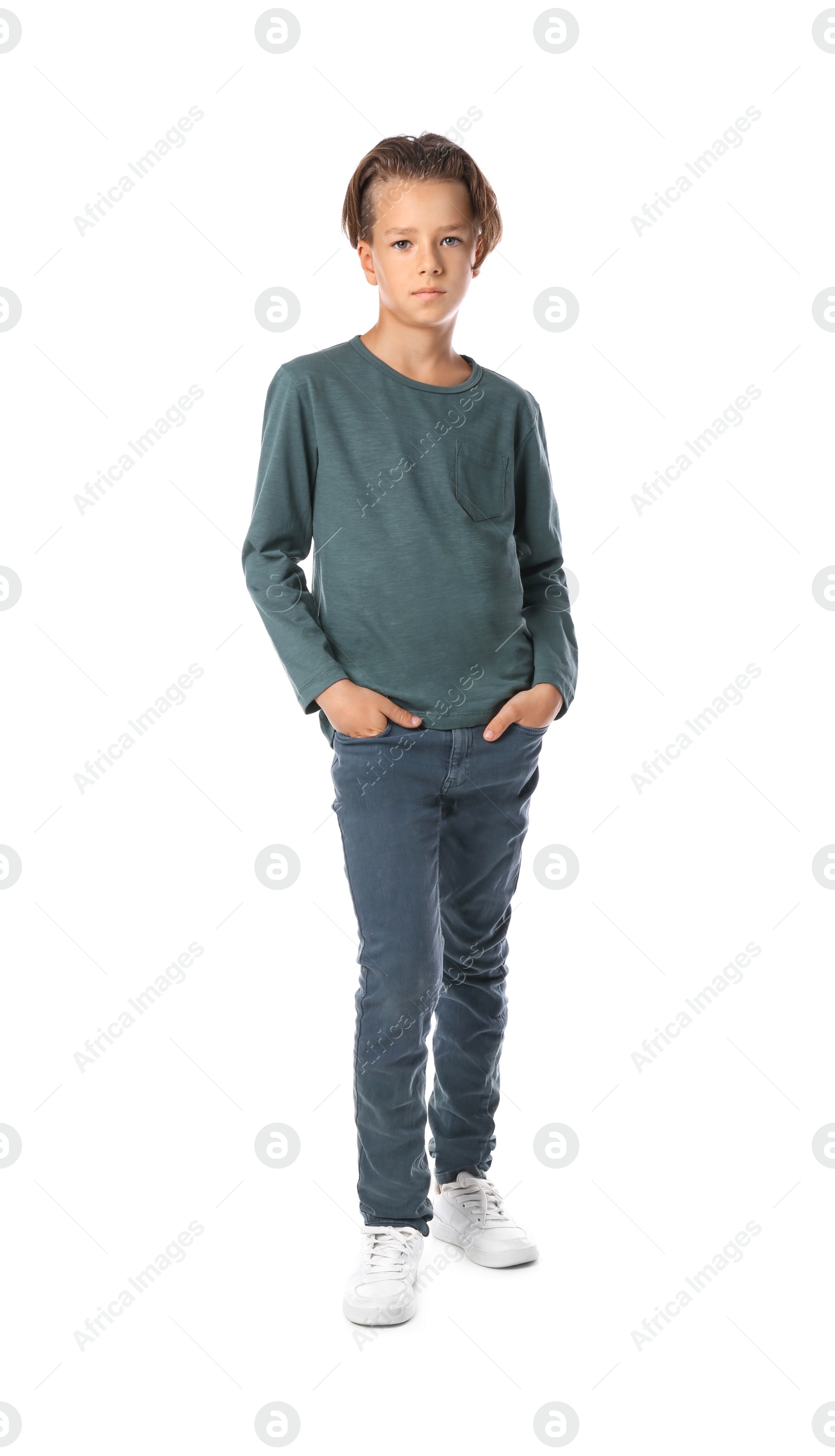 Photo of Portrait of cute little boy in casual outfit on white background