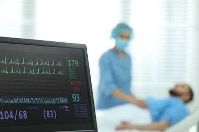 Photo of Monitor with cardiogram in hospital, focus on screen. Space for text