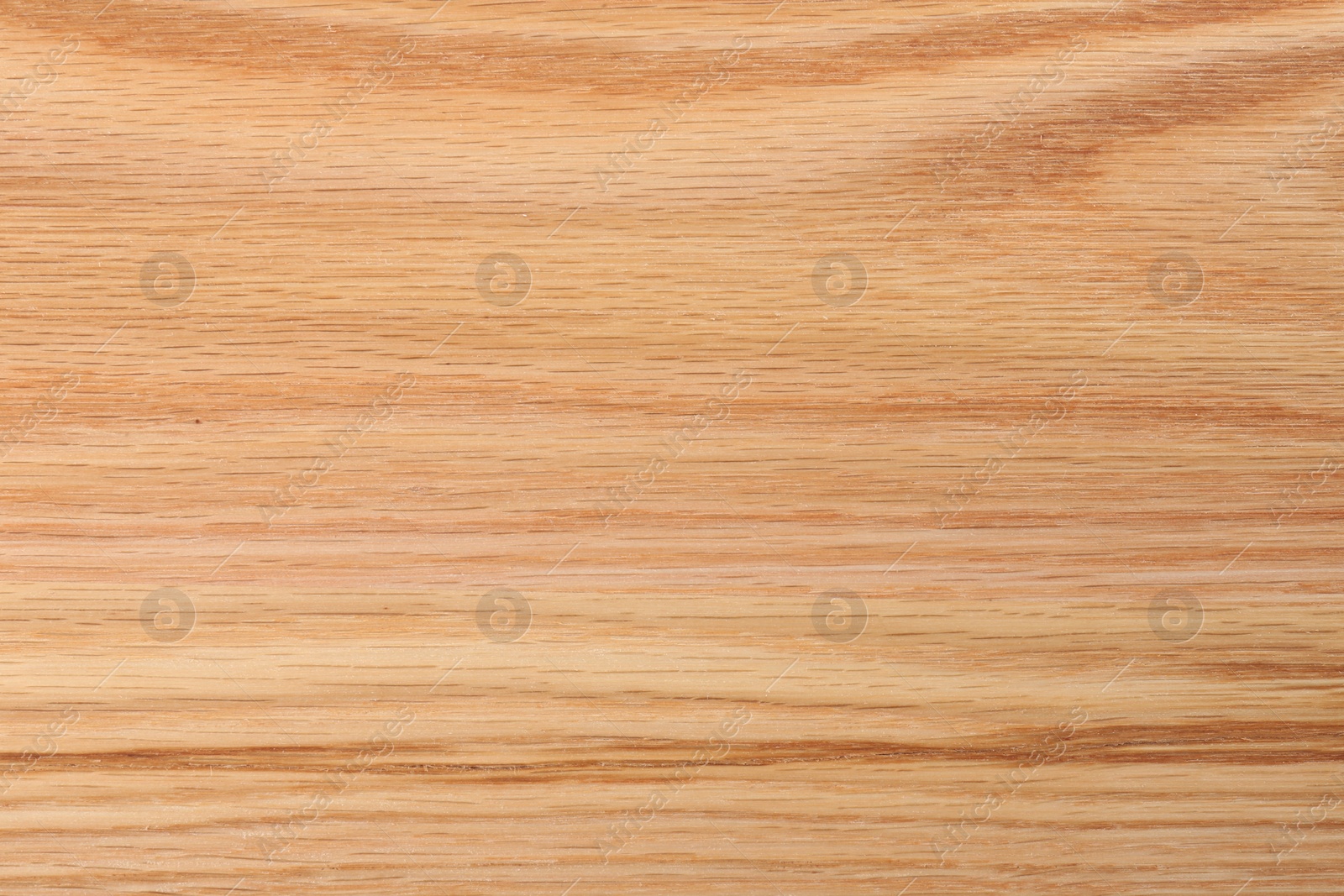 Photo of Texture of wooden cutting board as background, top view