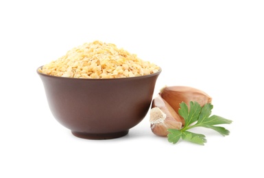 Photo of Bowl of granulated dry garlic and parsley on white background