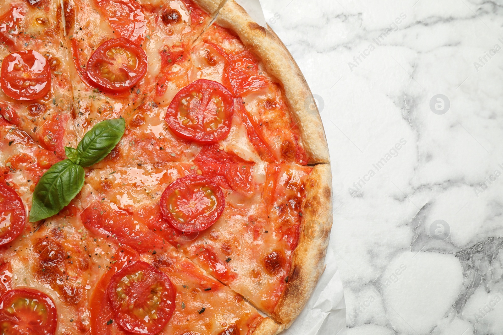 Photo of Delicious pizza Margherita on white marble table, top view