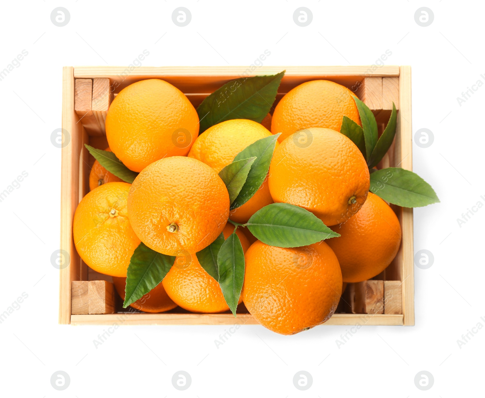 Photo of Fresh ripe oranges with green leaves in wooden crate on white background, top view