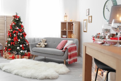 Photo of Living room interior with decorated Christmas tree
