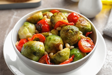 Bowl of salad with Brussels sprouts on table, closeup