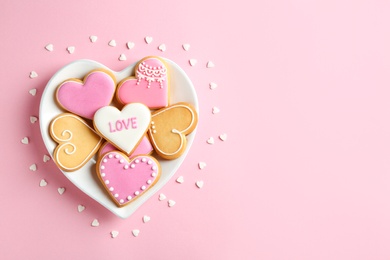 Photo of Flat lay composition with homemade heart shaped cookies and space for text on color background